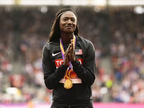 FILE - United States' Tori Bowie gestures after receiving the gold medal she won in the women's 100m final during the World Athletics Championships in London, Monday, Aug. 7, 2017. U.S. Olympic champion sprinter Tori Bowie died from complications of childbirth, according to an autopsy report. Bowie, who won three medals at the 2016 Rio de Janeiro Games, was found dead last month. She was 32.