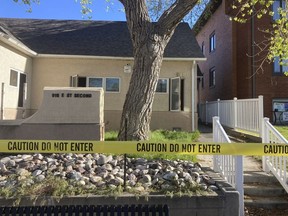 FILE - The fire-damaged Wellspring Health Access clinic is cordoned by tape on May 25, 2022, in in Casper, Wyo.