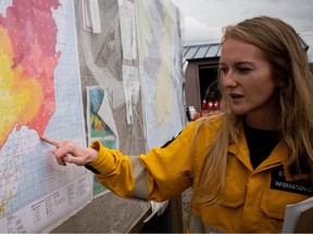Emily Smith, a wildfire information officer with Alberta Wildfire, at a camp outside Fort Chipewyan.