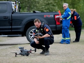 Members of the Civil Air Search and Rescue Association prepare to launch a drone during their search of the North Saskatchewan River North for a missing teen, in Edmonton Monday June 5, 2023. Photo by David Bloom