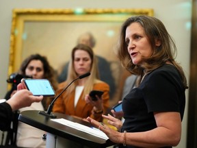 Deputy Prime Minister Chrystia Freeland holds a press conference on Parliament Hill, in Ottawa, Wednesday, June 14, 2023. Freeland says Canada will halt all government-led activity at the Asian Infrastructure Investment Bank after a Canadian citizen tendered his resignation from the bank, alleging it is dominated by the Chinese Communist Party.
