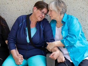 Stacey Worsfold, left, outside the Edmonton courthouse on Thursday, June 22, 2023, after a jury found Beryl Musila guilty of first-degree murder in 2017 death of her father, Ronald Worsfold.