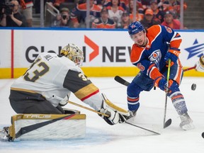 Kailer Yamamoto of the Edmonton Oilers, in front of goalie Adin Hill of the Las Vegas Golden Knights in game six of the second round of the NHL playoffs at Rogers Place in Edmonton on May 14, 2023.