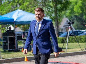Brian Jean walks into Government House as Alberta Premier Danielle Smith prepares to announce her cabinet on June 9 in Edmonton.