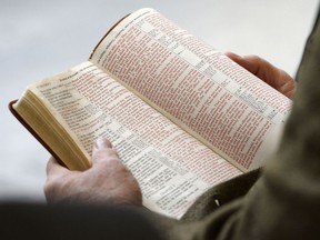 The Bible is read aloud at the Utah Capitol, Monday, Nov. 25, 2013. The Bible has been banned at elementary and middle schools in the Davis School District north of Salt Lake City, after a review committee decided it wasn't age appropriate "due to vulgarity or violence."