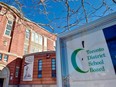 A Toronto District School Board sign is seen in front of a high school in Toronto.