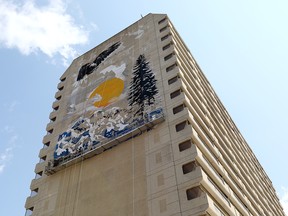 Artists create a massive mural on the Jasper One Eleven building, 11020 Jasper Avenue, in Edmonton Wednesday, July 5, 2023.