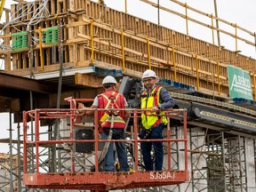 federal minister Alghabra inspects a construction site for the 50th street overpass in Edmonton