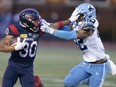 Montreal Alouettes wide receiver Chandler Worthy (30) is called for face masking against Toronto Argonauts defensive back Qwan'tez Stiggers (42) during first half CFL football action in Montreal, Friday July 14, 2023.