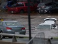 Abandoned cars in a mall parking lot are seen in floodwater following a major rain event in Halifax on Saturday, July 22, 2023.