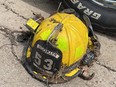 Logan Hope's battered volunteer firefighter helmet, retrieved after he rescued a woman and they were briefly swept along a torrent flowing down Ellershouse Road, in Ellershouse, N.S. on Saturday, July 22, 2023, is shown in a handout photo.