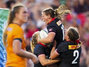 Canada's Claire Gallagher (10) celebrates with teammates after scoring a try against Australia during second half rugby action at the Pacific Four Series in Ottawa on Friday, July 14, 2023.