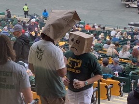 Edmonton Elks fans with heads in paper bags