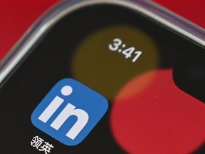 This photo illustration taken on October 15, 2021 shows the LinkedIn China application on a mobile phone in Beijing.