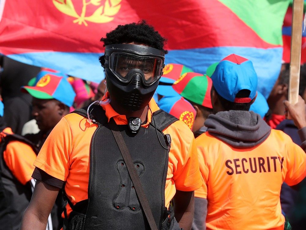 A riot broke out between pro government Eritrean supporters (pictured in orange) and anti-Eritrean government protesters at the Rosslyn Park soccer fields, 113A Street and 132 Avenue, on Saturday, Aug. 19, 2023.