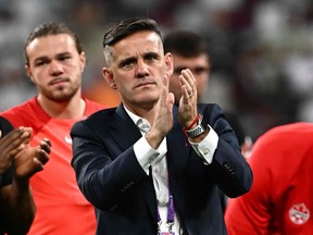 Canada's coach John Herdman applauds Croatia after the Qatar 2022 World Cup Group F football match.