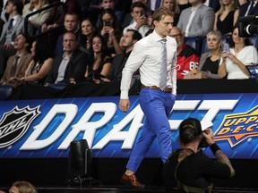 Connor Bedard says he's not Connor McDavid and wants to carve his own path as a player. Bedard, Chicago Blackhawks first round draft pick, makes his way to the stage during the first round of the NHL hockey draft, in Nashville, Tenn., Wednesday, June 28, 2023.