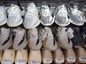 FILE - Yeezy shoes made by Adidas are displayed at Laced Up, a sneaker resale store, in Paramus, N.J., on Oct. 25, 2022. Adidas is releasing a second batch of high-end Yeezy sneakers after cutting ties with rapper Ye, formerly known as Kanye West, as the shoemaker seeks to unload the unsold shoes while donating to groups fighting antisemitism. The online sale, to start Wednesday Aug. 2, 2023 through the Confirmed app, Adidas app and adidas.com, follows an earlier batch of sales in May.