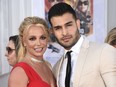 FILE - Britney Spears and Sam Asghari appear at the Los Angeles premiere of "Once Upon a Time in Hollywood" on July 22, 2019. Asghari has filed for divorce from Spears, a person familiar with the filing said late Wednesday, Aug. 16, 2023. The person, who is close to Asghari but not authorized to speak publicly, confirmed the filing happened Wednesday, hours after several outlets including TMZ and People magazine reported the couple had separated.