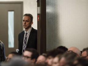 Jordan Peterson waits to speak to a crowd during a stop in Sherwood Park, Alta., in February 2018.
