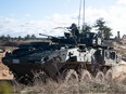 Canadian Armed Forces soldiers manoeuvre a LAV 6 Infantry Fighting Vehicle in Latvia in 2021. The contract for the Light Armoured Vehicle Reconnaissance Surveillance System project to provide 66 upgraded LAV with a new reconnaissance and surveillance system was awarded in 2014 and delivery of the vehicles was supposed to begin two years later.