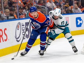 Edmonton Oilers Ryan McLeod (71) battles fore the puck with San Jose SharksThomas Bordeleau (17) during first period NHL action on Thursday, April 13, 2023 in Edmonton . Greg Southam-Postmedia