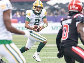 Edmonton Elks quarterback Tre Ford runs the ball against the Calgary Stampeders during the Labour Day Classic at McMahon Stadium on Monday, Sept. 4, 2023.