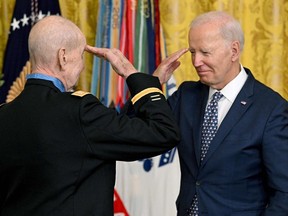 President Joe Biden salutes U.S. Army Captain Larry Taylor during a Medal of Honor ceremony in the White House Sept. 5, 2023. Many Republicans badly want to impeach Biden.