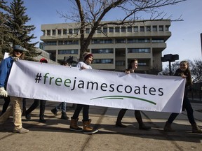 Supporters rally outside court as pastor James Coates, of GraceLife Church, is in court to appeal the bail conditions, after he was arrested for holding day services in violation of COVID-19 rules in Edmonton, Alta., on Thursday March 4, 2021. Pandemic-era public health charges have been dropped against the Edmonton-area pastor and church, as well as a central Alberta man who hosted a rodeo in protest of COVID-19 restrictions.