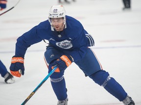 Brandon Sutter skates in an Oilers practice jersey