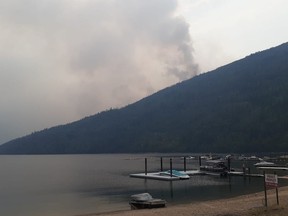 Evacuation orders for some properties in the Kamloops and Shuswap Lake areas affected by two separate wildfires have been lifted and placed on alert status. Smoke rises from the Bush Creek East wildfire in an undated handout photo.