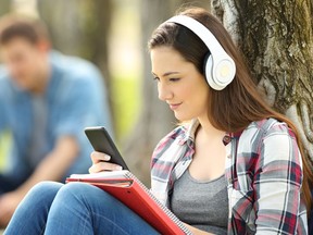 Student learning on line with headphones
