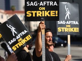 Striking SAG-AFTRA members picket outside Warner Bros. Studio as the actors strike continues on September 26, 2023 in Burbank, California.