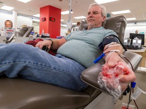 Roger Peterson donates blood at Canadian Blood Services on Monday, Oct. 16, 2023, in Edmonton. Canadian Blood Services needs more than 3,600 Edmontonians to donate blood between now and Nov. 11.