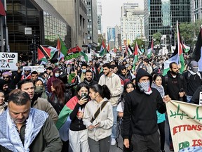People take part in a pro-Palestinian protest in Montreal on Sunday, Oct. 8, 2023.
