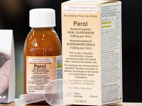 A bottle of Parol sits on a surface next to its box
