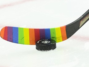 An Ottawa Senators player warms-up with rainbow-coloured hockey tape prior to taking on the Vancouver Canucks in NHL hockey action in Ottawa on Wednesday, April 28, 2021.