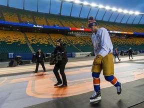 Connor McDavid (97) walks toward the ice surface at Commonwealth Stadium