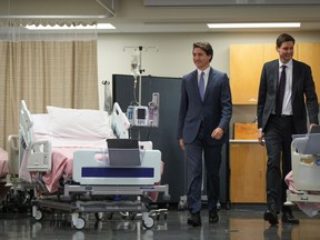 British Columbia is the first province to sign a tailored funding agreement with the federal government as part of the $196 billion health accord the prime minister offered provinces earlier this year. Prime Minister Justin Trudeau, left, and B.C. Premier David Eby arrive for a healthcare funding announcement at Kwantlen Polytechnic University, in Langley, B.C., on Wednesday, March 1, 2023.