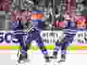 Edmonton Oilers' Brett Kulak (27), Darnell Nurse (25) and Ryan Nugent-Hopkins (93) celebrate a goal against the Anaheim Ducks.