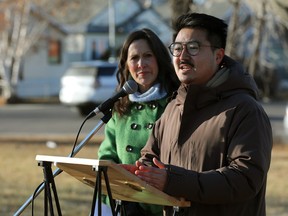 NDP MP Blake Desjarlais (Edmonton – Griesbach) and NDP candidate for Edmonton Centre Trisha Estabrooks stand at a podium outdoors
