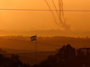 Smoke from rockets being fired from the Palestinian enclave towards Israel, amid ongoing battles between Israel and the Palestinian Hamas movement.