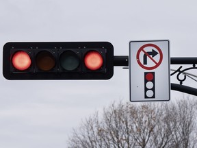 A sign prohibiting right turns at a red light is seen Friday, November 10, 2023 in Deux-Montagnes, Que.