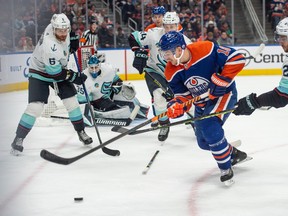 Zach Hyman (18)of the Edmonton Oilers, skates away from Alex Wennberg(21)