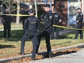 Windsor police officers are shown at a townhouse in the 1400 block of Southdale Drive on Tuesday, November 14, 2023. A 62-year-old Windsor man has been charged with first-degree murder in connection with the death of his wife.