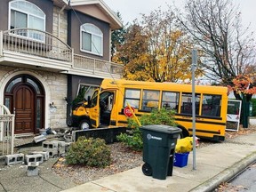A school bus has crashed into a home in Burnaby and police have asked drivers to avoid the busy stretch of Canada Way near 16th Avenue. Photo: Nick Procaylo
