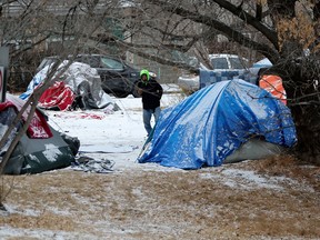 A homeless encampment near Rowland Road and 95 Street in Edmonton on Tuesday, Dec. 19, 2023.