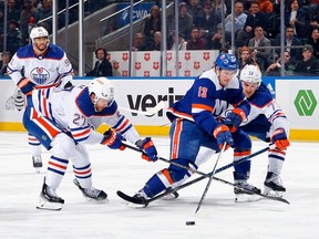 Oilers defed against Islanders forward Matthew Barzal