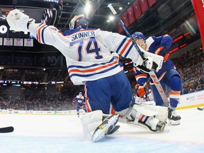 ELMONT, NEW YORK - DECEMBER 19: Stuart Skinner #74 of the Edmonton Oilers tends net against the New York Islanders at UBS Arena on December 19, 2023 in Elmont, New York. The Islanders defeated the Oilers 3-1.