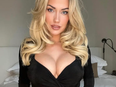 Golf influencer Paige Spiranac poses for a photo.